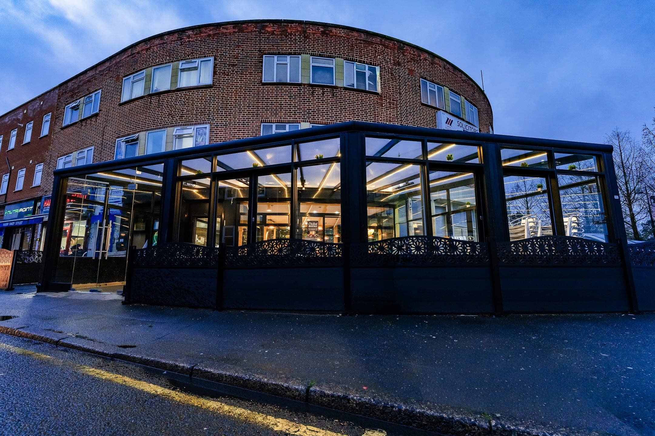 Commercial restaurant terrace covered by connected aluminium verandas