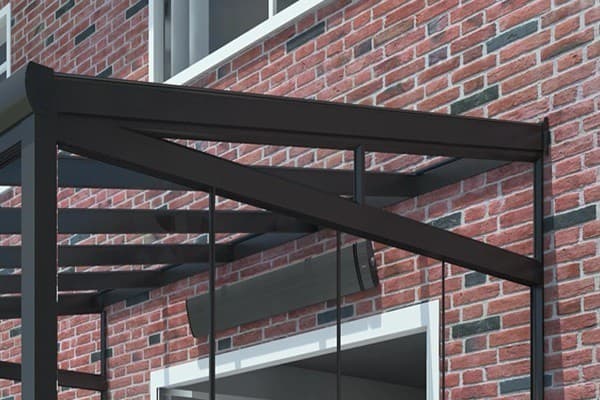 Custom glass triangle wedge closing the gable apex space between house wall and sloped veranda roof