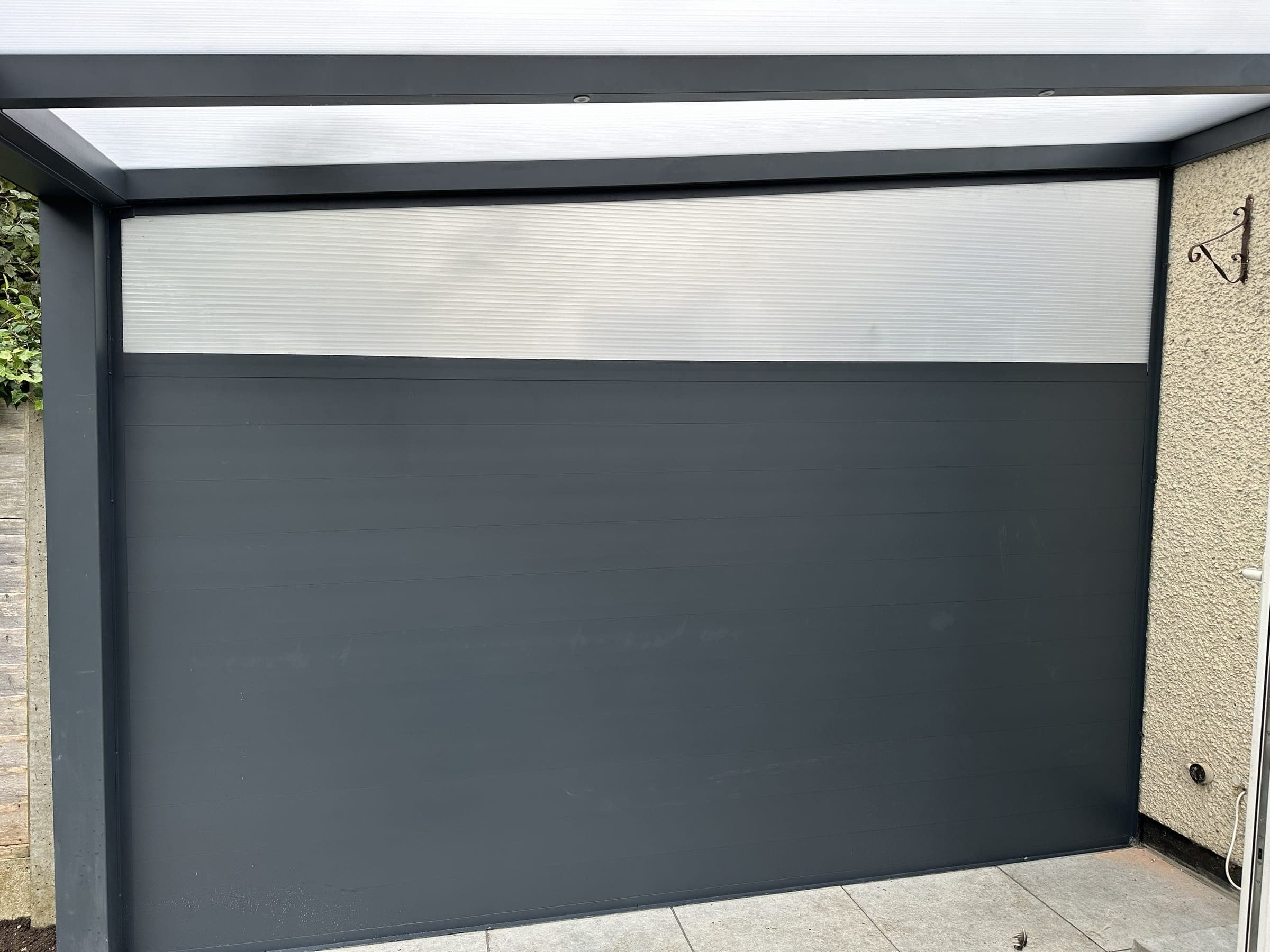Side wall enclosure on an outdoor veranda featuring opaque panels